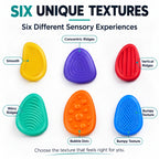 Six textured Kalmzo sensory fidget stones providing different tactile sensory experiences.